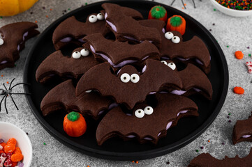 Halloween cookies. Chocolate sandwich cookies in the shape of a bat with eyes and butter cream....