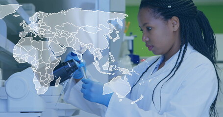Pipetting scientist wearing lab coat, gloves at lab bench, with pipette and test tube, copy space