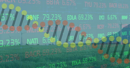 Displaying stock chart overlay highlighting data points and bars over farmland with turbines, silo