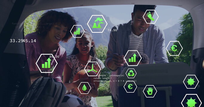 Family unpacking cooler in SUV trunk at forest mountain overlook, with soccer ball and data icons