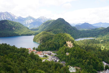 The yellow castle Hohenschwangau Castle nestled in the Bavarian forest