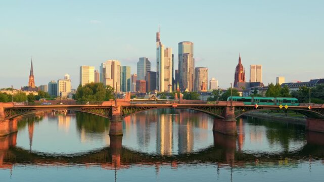 Frankfurt City Downtown, Tram on Ignatz Bubis Bridge and Main River at Summer Sunrise. Hesse, Germany