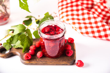 Homemade raspberry jam with fresh berries