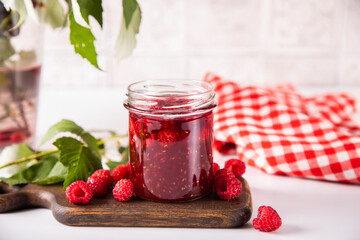 Homemade raspberry jam with fresh berries