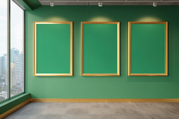 Three empty gold frames on green wall in modern gallery with city view. room has minimalist design and ample natural light