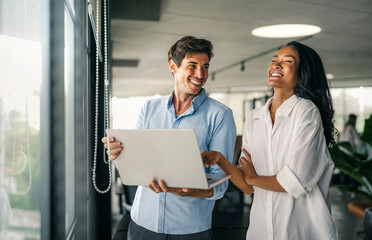 A diverse, talented team collaborates effectively in a bright office space during a business meeting