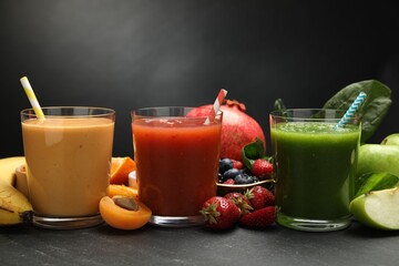 Superfood. Refreshing smoothies in glasses and ingredients on dark textured table, closeup