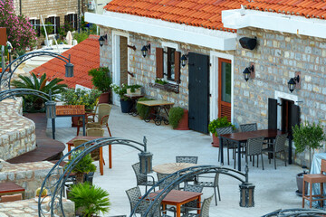 An outdoor cafe or restaurant with cozy interior details and decorations.
