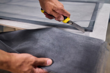 Hand Assembling a Frame on a Beautiful and Modern Table in a Creative Workspace