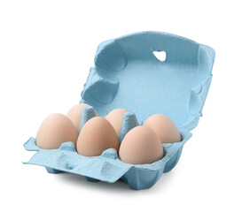 Raw chicken eggs in egg carton isolated on white