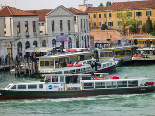 Exploring the beautiful canals with river taxis in Venice, Italy.