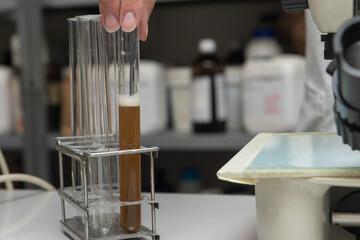 Close up detail of a scientist working with substances in a laboratory.