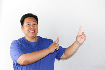 man pointing up his hand into copy space