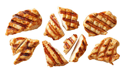 Grilled chicken pieces arranged in a visually appealing pattern.  Golden-brown, cooked chicken breast, sliced into bite-sized pieces, showing grill marks