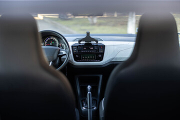 Electric car control panel with steering wheel and seat heating. Switching ON heated seats of car...