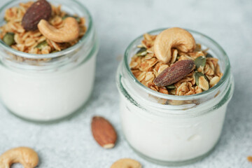Close up of Homemade healthy breakfast, bowl with greek yogurt and granola.