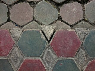 Colorful Hexagonal Paving Stones with a crack in the middle