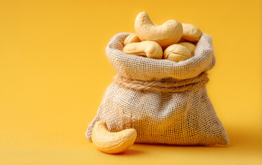 Organic cashew in sac on yellow background for retail banner