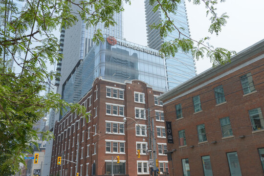 The Thomson Reuters building at 19 Duncan Street in Toronto, designed by Hariri Pontarini Architects with heritage work by ERA Architects in a modern mixed‑use style, developed by Westbank Corp