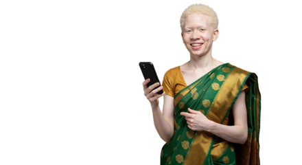 Young woman with albinism smiling while using smartphone in sari  