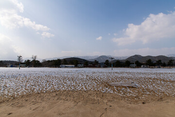 snow-covered ground and mountain in winter