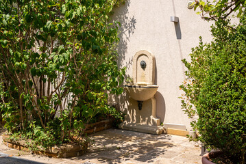 Decorative detail on a house wall in a garden
