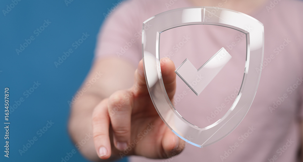 Poster hand pointing at a transparent shield icon with a checkmark. data security, approved, safety.