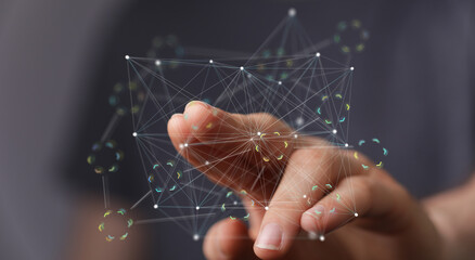 Hand interacts with a digital network, symbolizing global connection and technological advancement.