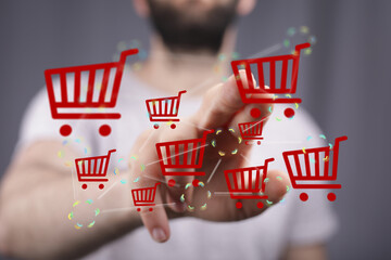 Image of a person interacting with a network of shopping carts, representing online shopping and...