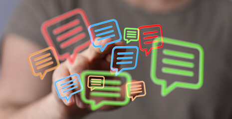 Hand interacting with digital speech bubbles,communication, messaging, social media concept.