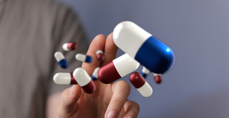 Colorful pills levitating above a hand.  Health, medicine, pharmacy concept.