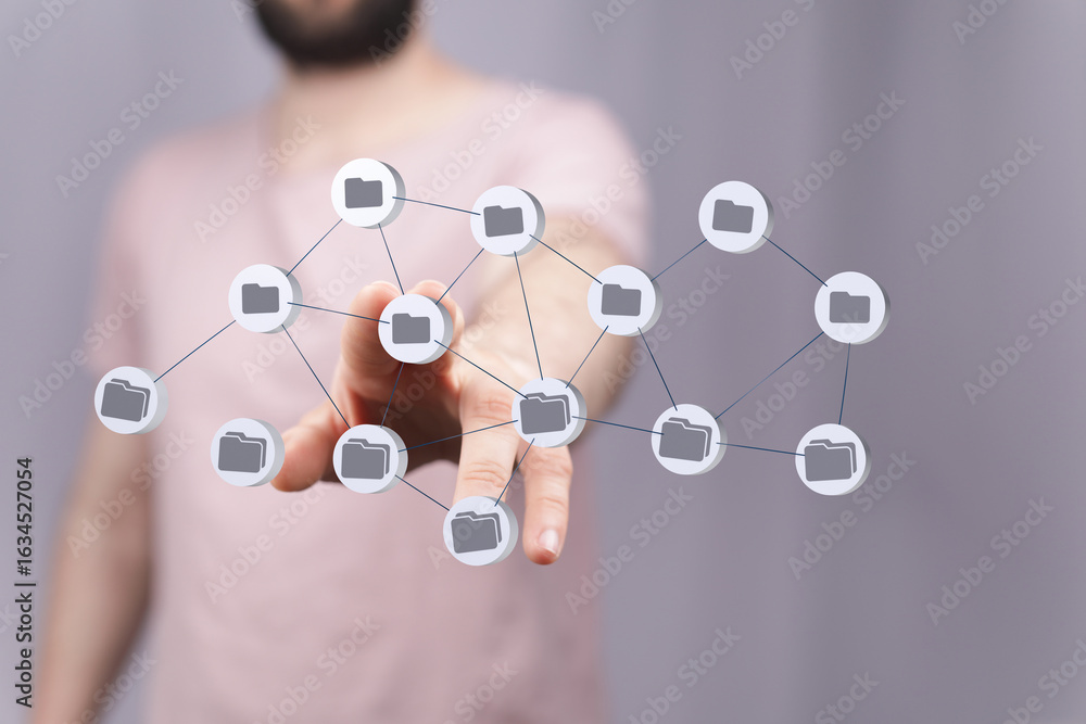 Poster image of a person interacting with a network of digital files, showcasing data sharing and connectiv