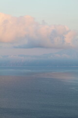 Obraz premium Pink clouds over the sea