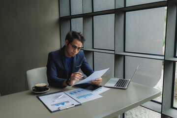 Male office worker overwhelmed by deadlines, staring at screen in frustration.