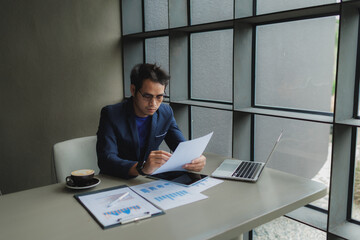 Male office worker overwhelmed by deadlines, staring at screen in frustration.