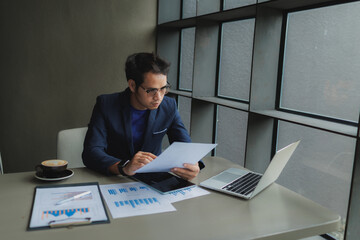 Male office worker overwhelmed by deadlines, staring at screen in frustration.