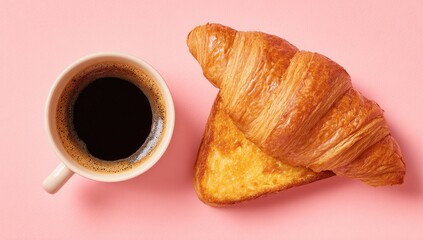 A cup of coffee and two croissants on a pink surface