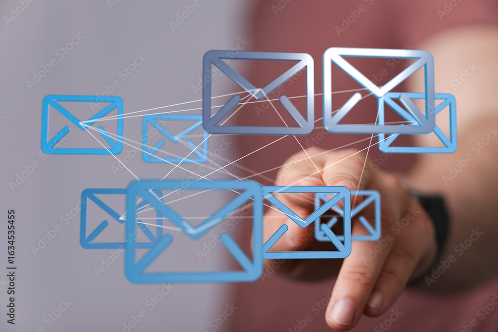 Poster hand interacting with a network of email icons, representing global communication and connectivity.