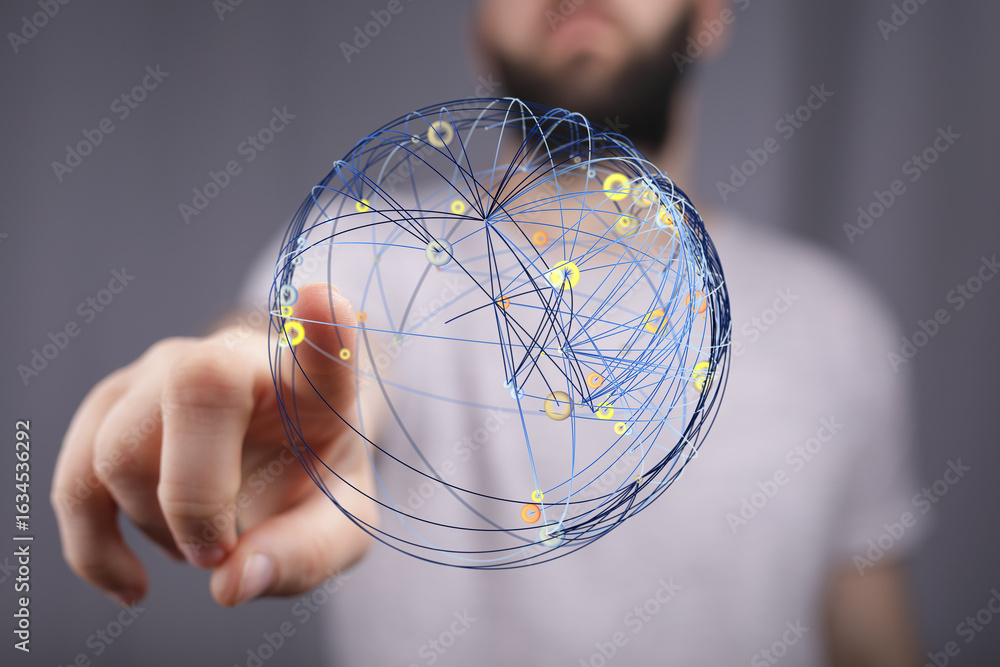 Poster image of a person interacting with a digital sphere representing global network connections and data