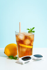 Summer cold drink on colored background with hard shadows.