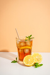 Summer cold drink on colored background with hard shadows.