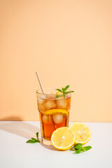 Summer cold drink on colored background with hard shadows.