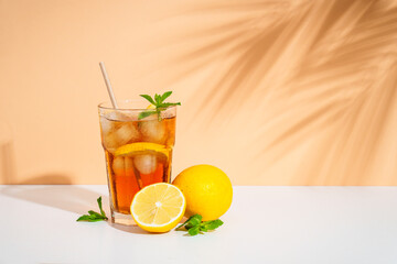 Summer cold drink on colored background with hard shadows.