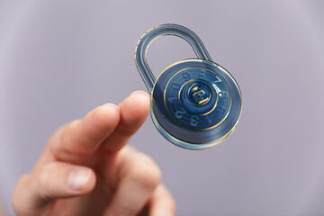 Secure your data.  Concept image of a hand and digital combination lock.