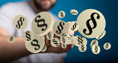 Abstract image of paragraph symbols floating around a hand, representing law, legal, justice, and...
