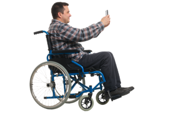 Empowerment in Motion: A Man in a Wheelchair Capturing Moments with Technology png.