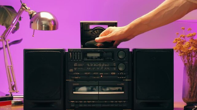 Retro radio tape recorder, audio cassette close-up. Listening to music, old radio boom box player, macro of vintage music listening. 