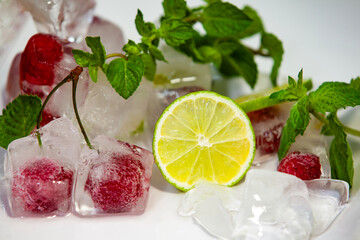 Icy texture with berry, cherry and lemon cubes. Top view of frozen drink ingredients with natural highlights.