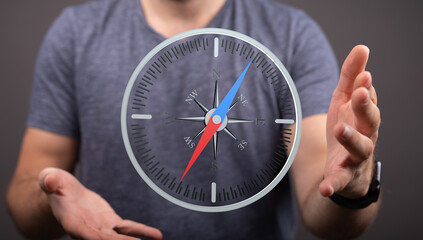 A man holds a digital compass, symbolizing guidance and direction.  Perfect for business, travel,...