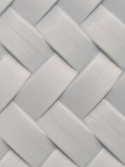 The pattern resembles a flat ribbon weave, with the strips alternating between overlapping (over...